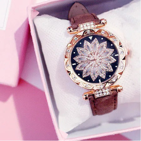 Women's diamond decorative watch with round dial showing red colour option and pin buckle clasp