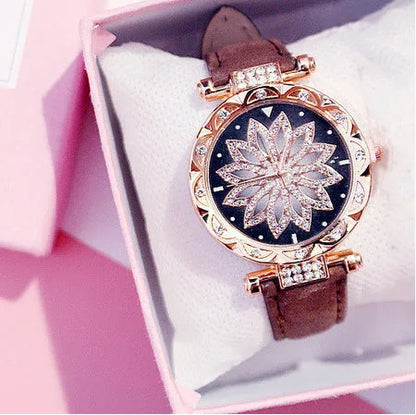 Women's diamond decorative watch with round dial showing red colour option and pin buckle clasp