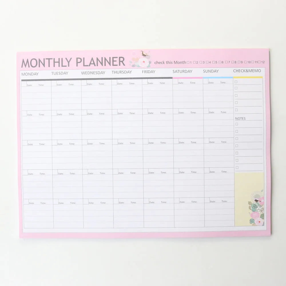 Paper brick desk organiser pad showing weekly and monthly planning sections with pink and green mixed colours