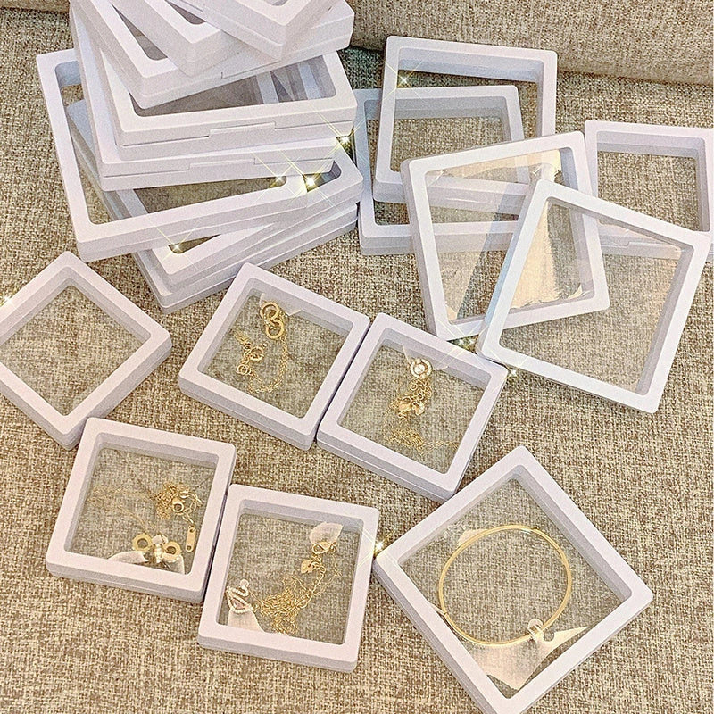 3D floating jewelry coin display stand in white and black, showcasing collectibles in mid-air
