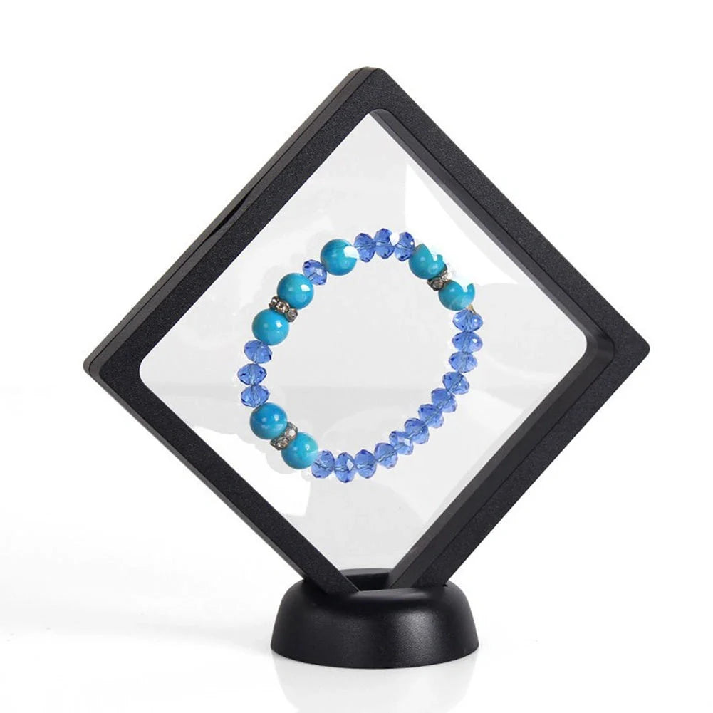 3D floating jewelry coin display stand in white and black, showcasing collectibles in mid-air