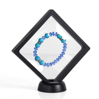 3D floating jewelry coin display stand in white and black, showcasing collectibles in mid-air