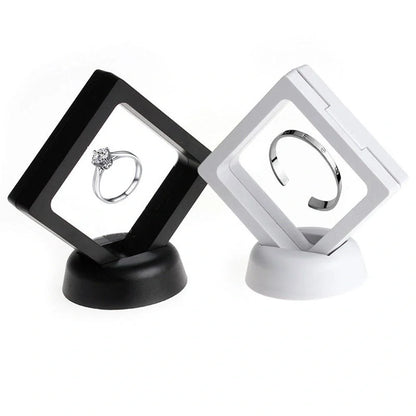 3D floating jewelry coin display stand in white and black, showcasing collectibles in mid-air