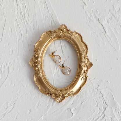 Golden retro photo frame for jewelry and art display in Nordic style
