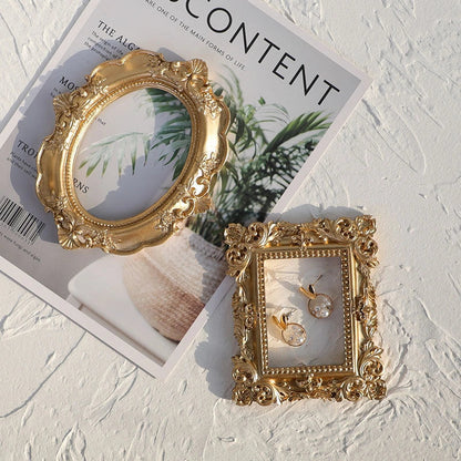 Golden retro photo frame for jewelry and art display in Nordic style