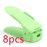 A stackable plastic shoe storage cabinet with two open shelves, shown in a choice of colours.