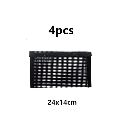 Black grill mesh bag with non-stick grid mat for BBQ cooking showing smoke-through design