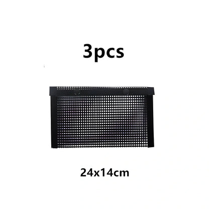 Black grill mesh bag with non-stick grid mat for BBQ cooking showing smoke-through design