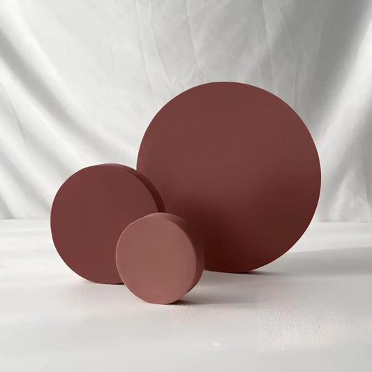 Set of white round and square plastic props for cosmetics shooting, 10cm diameter rounds and 8cm squares for stable product displays