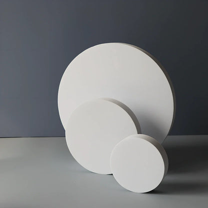 Set of white round and square plastic props for cosmetics shooting, 10cm diameter rounds and 8cm squares for stable product displays