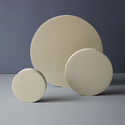 Set of white round and square plastic props for cosmetics shooting, 10cm diameter rounds and 8cm squares for stable product displays