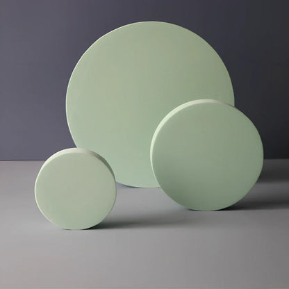 Set of white round and square plastic props for cosmetics shooting, 10cm diameter rounds and 8cm squares for stable product displays