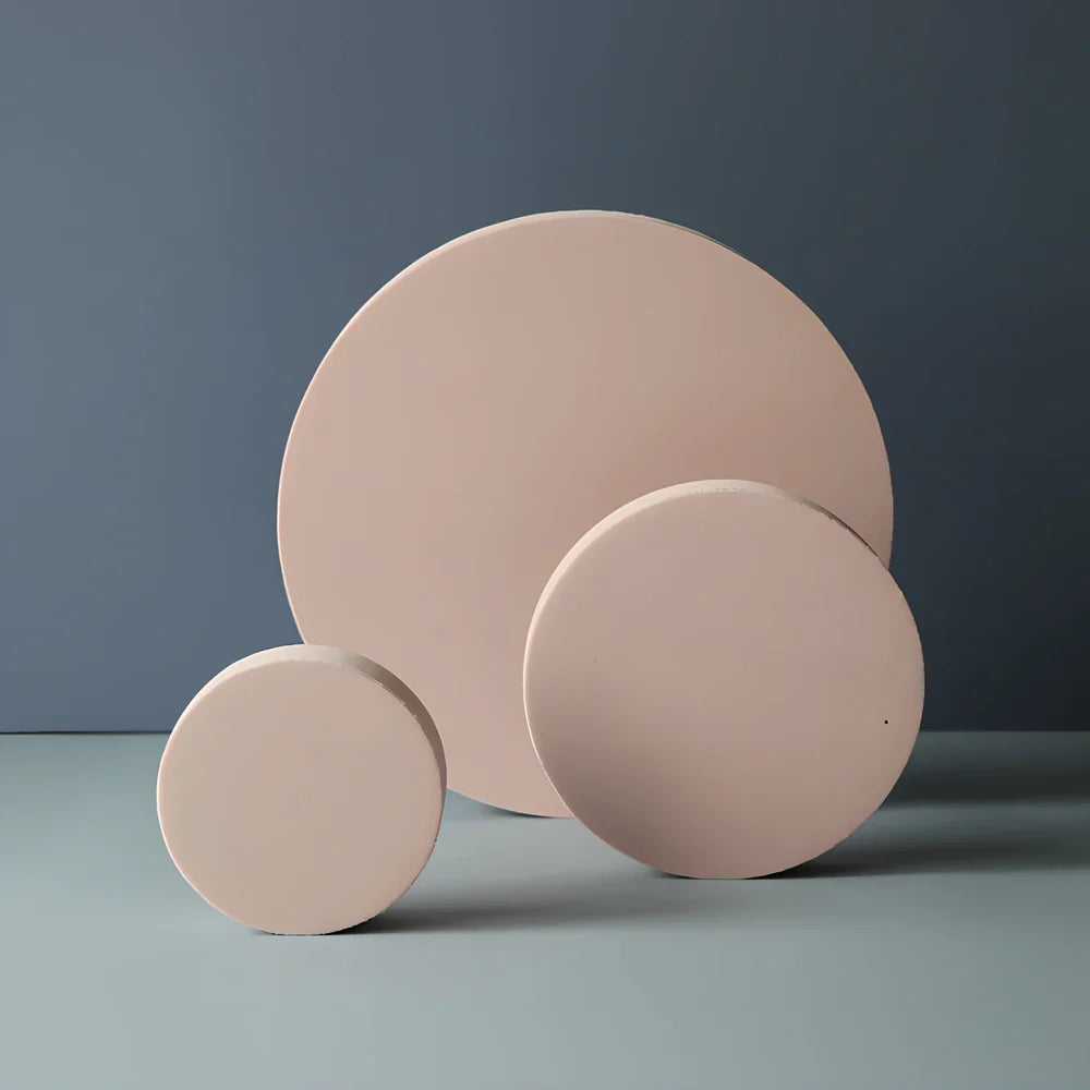 Set of white round and square plastic props for cosmetics shooting, 10cm diameter rounds and 8cm squares for stable product displays