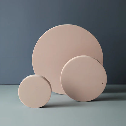 Set of white round and square plastic props for cosmetics shooting, 10cm diameter rounds and 8cm squares for stable product displays
