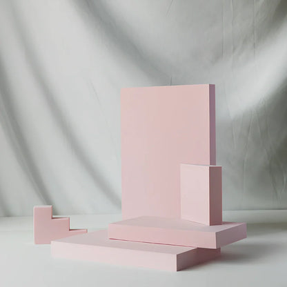 Set of white round and square plastic props for cosmetics shooting, 10cm diameter rounds and 8cm squares for stable product displays