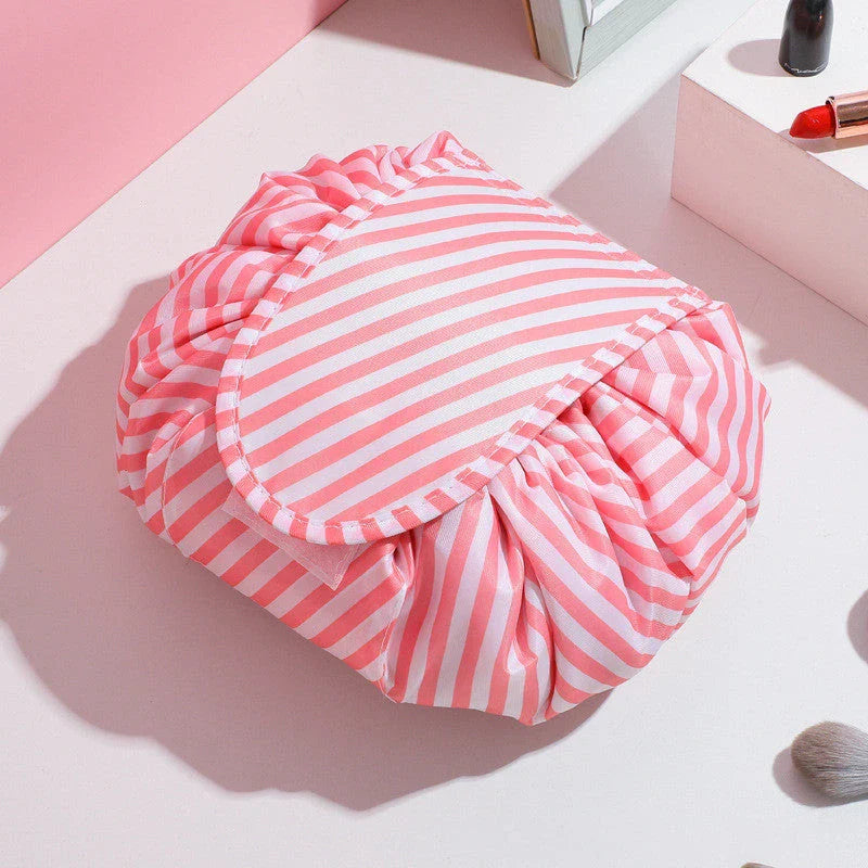 Stylish and roomy makeup travel bag with multiple color options, featuring a spacious interior and drawstring closure for secure storage of beauty essentials.