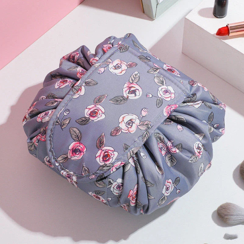 Stylish and roomy makeup travel bag with multiple color options, featuring a spacious interior and drawstring closure for secure storage of beauty essentials.