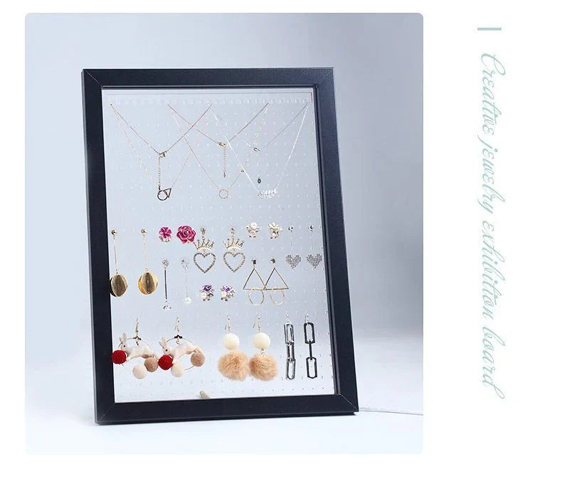 Minimalist wood and acrylic jewelry organizer with LED lighting for displaying and storing earrings, necklaces, and other jewelry