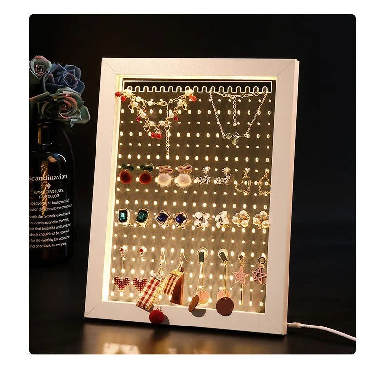 Minimalist wood and acrylic jewelry organizer with LED lighting for displaying and storing earrings, necklaces, and other jewelry