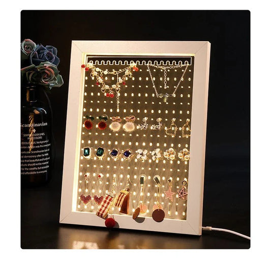 Minimalist wood and acrylic jewelry organizer with LED lighting for displaying and storing earrings, necklaces, and other jewelry