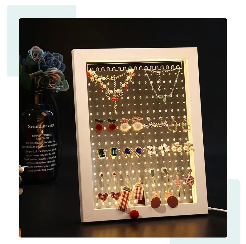 Minimalist wood and acrylic jewelry organizer with LED lighting for displaying and storing earrings, necklaces, and other jewelry