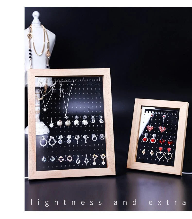 Minimalist wood and acrylic jewelry organizer with LED lighting for displaying and storing earrings, necklaces, and other jewelry