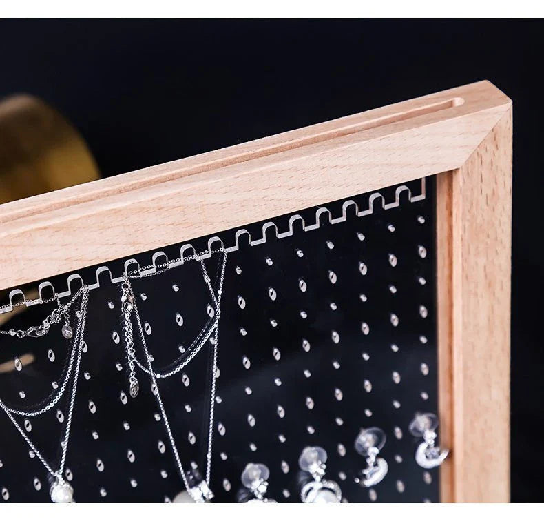 Minimalist wood and acrylic jewelry organizer with LED lighting for displaying and storing earrings, necklaces, and other jewelry