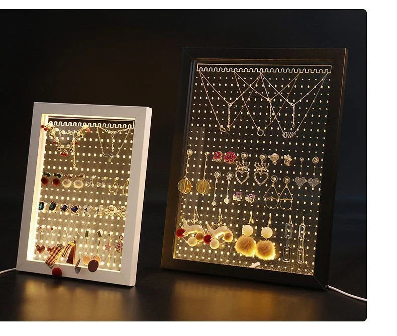 Minimalist wood and acrylic jewelry organizer with LED lighting for displaying and storing earrings, necklaces, and other jewelry
