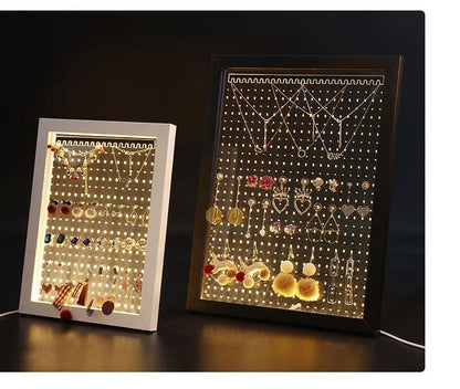 Minimalist wood and acrylic jewelry organizer with LED lighting for displaying and storing earrings, necklaces, and other jewelry