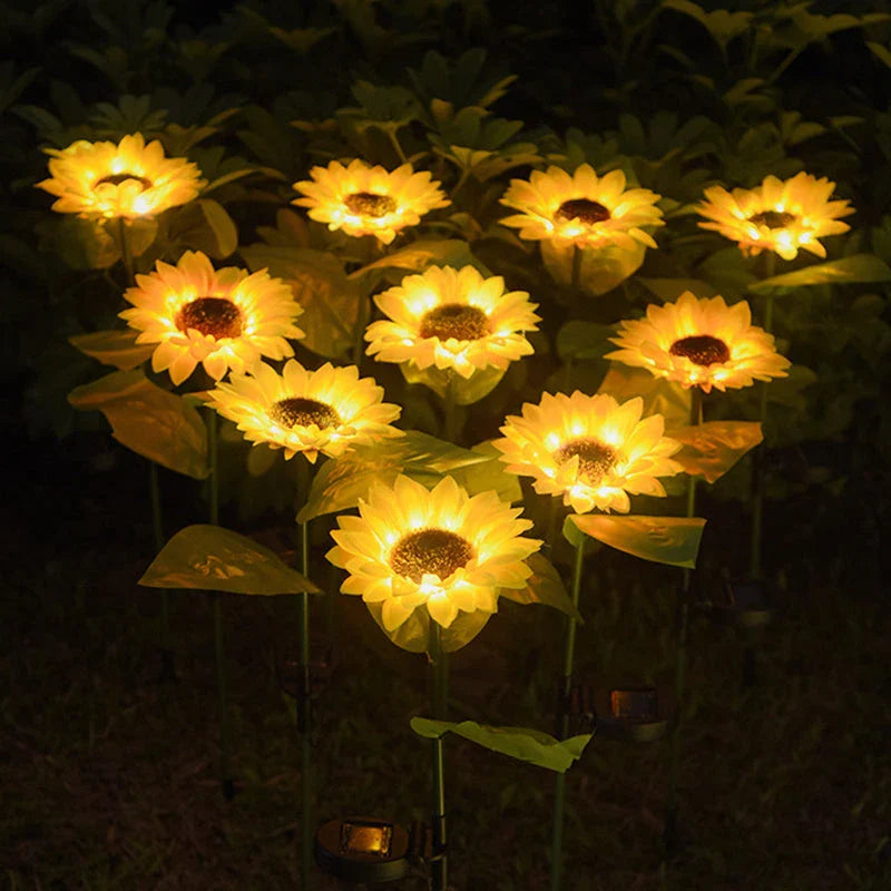 Elegant solar-powered sunflower lamps illuminating a serene outdoor garden pathway
