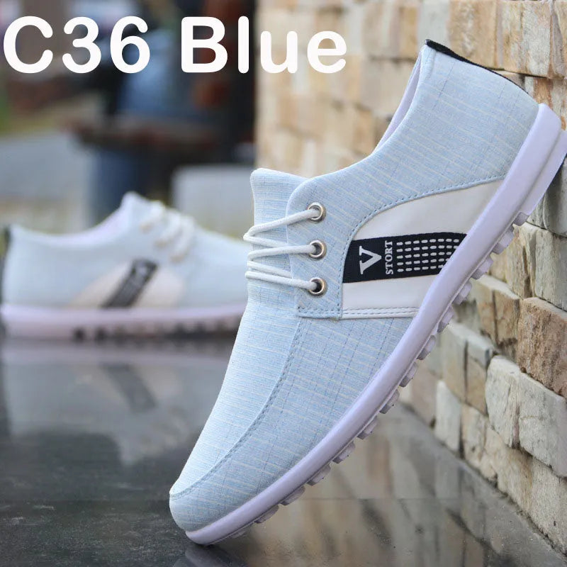 Men's soft-soled canvas shoes in blue or grey with round toe, low 1-3cm heel, and colour stitching.