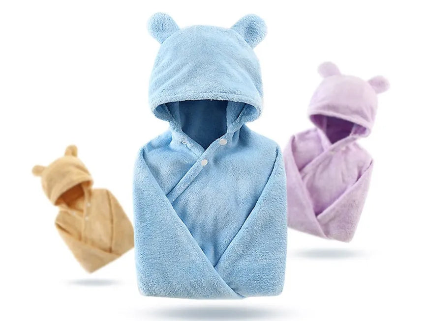 Blue hooded baby bath towel with dimensions 65cm by 110cm laid flat.