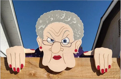 Charming garden fence decorations featuring quirky depictions of curious older adults