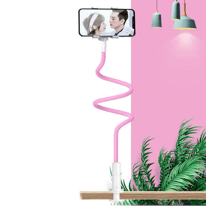 Flexible memory alloy mobile phone holder in blue colour positioned beside a bed
