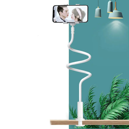 Flexible memory alloy mobile phone holder in blue colour positioned beside a bed