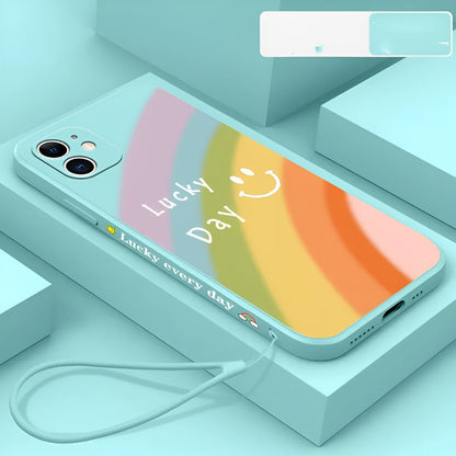 Rainbow smiley silicone phone case for iPhone in blue, showing all-inclusive design and back cover detail.