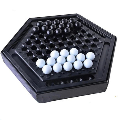 Abalone family board game with marble pieces on a wooden game board