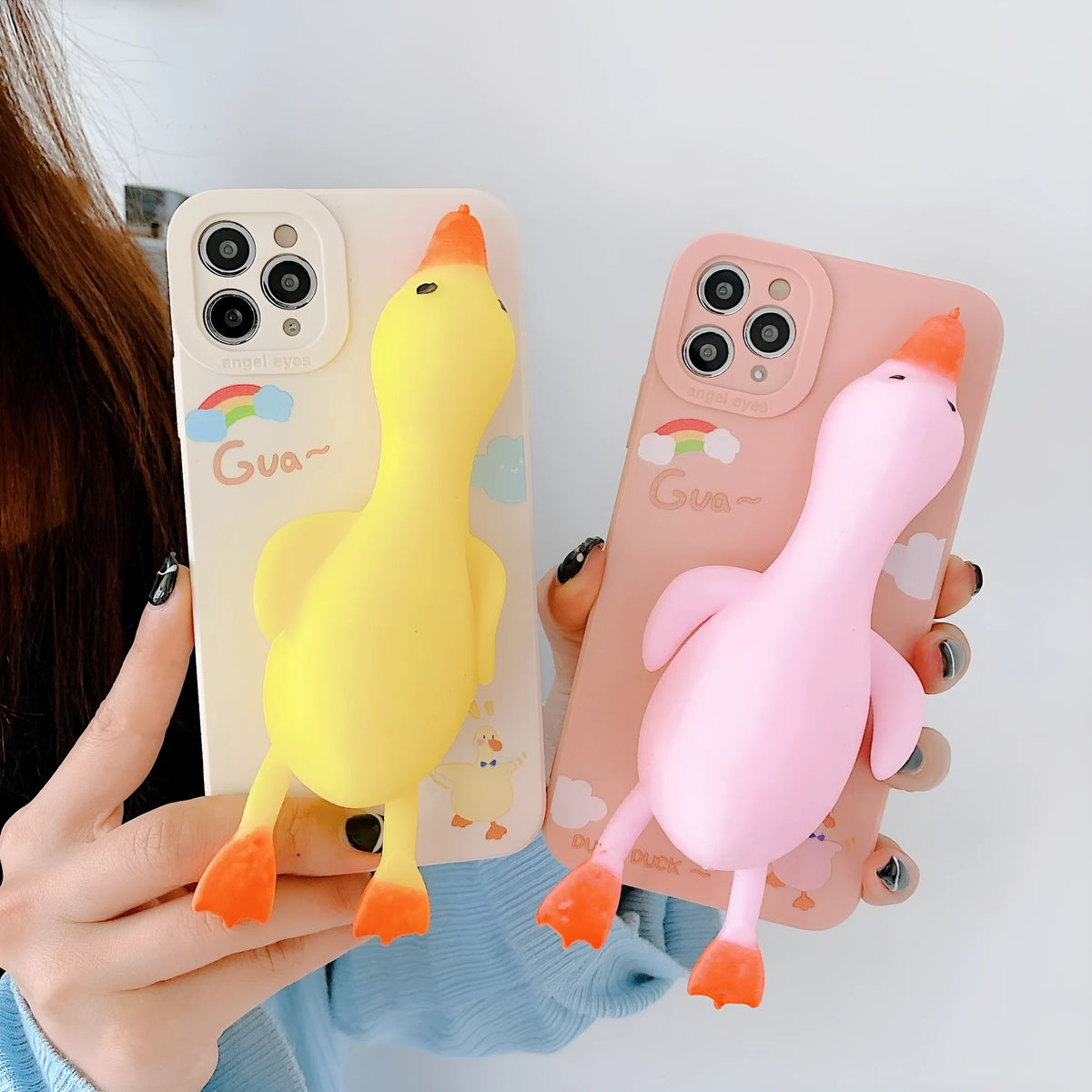 iPhone silicone phone case with straight sides and cartoon print design in yellow, white, or pink