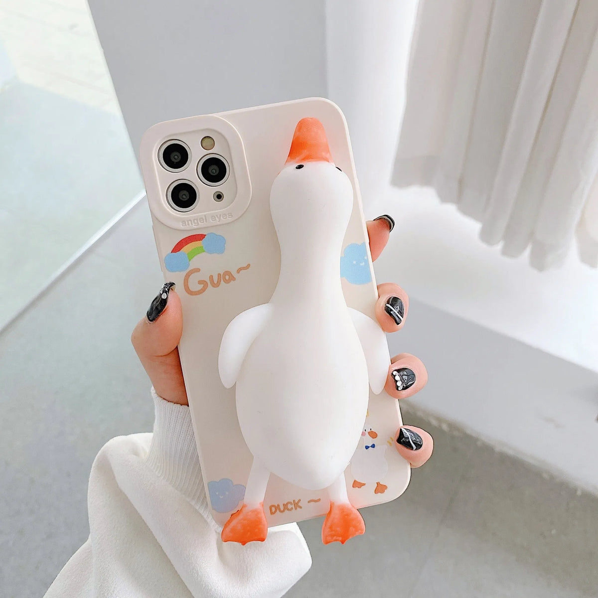 iPhone silicone phone case with straight sides and cartoon print design in yellow, white, or pink