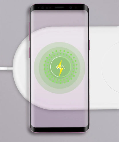 White dual phone wireless charging pad for simultaneous fast charging of two mobile phones