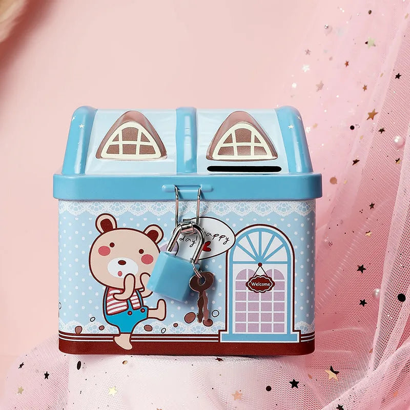 Blue tinplate house-shaped piggy bank with coin slot on round base