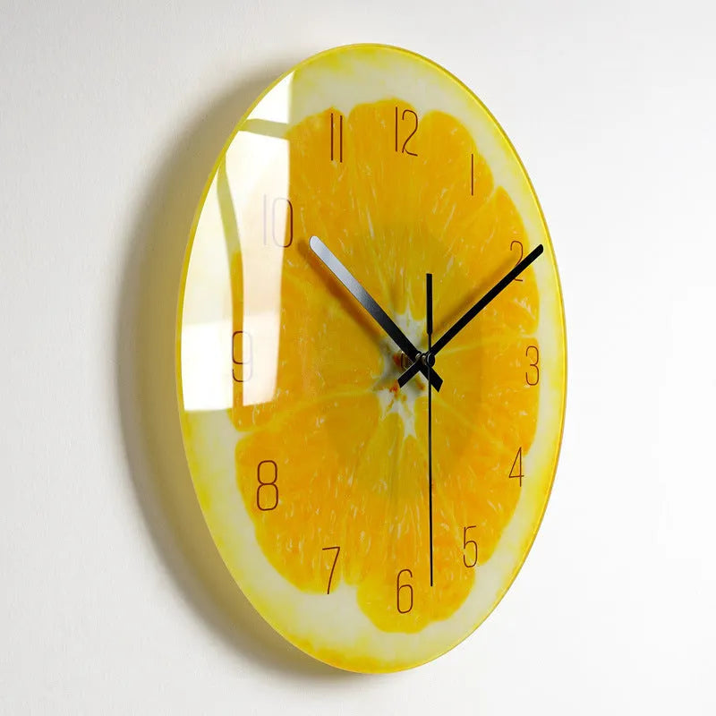 Round silent wall clock with acrylic glass dial, shown in a living room setting.