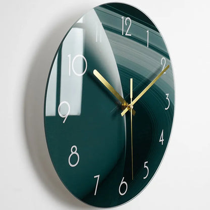 Round silent wall clock with acrylic glass dial, shown in a living room setting.