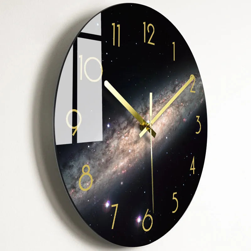 Round silent wall clock with acrylic glass dial, shown in a living room setting.