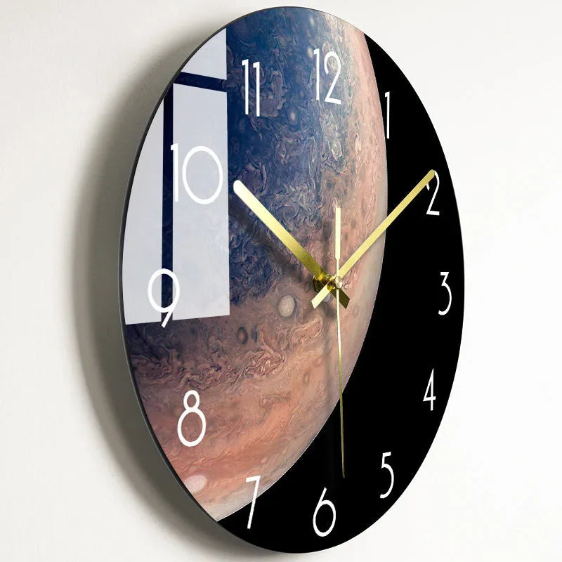 Round silent wall clock with acrylic glass dial, shown in a living room setting.