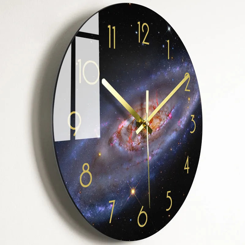 Round silent wall clock with acrylic glass dial, shown in a living room setting.