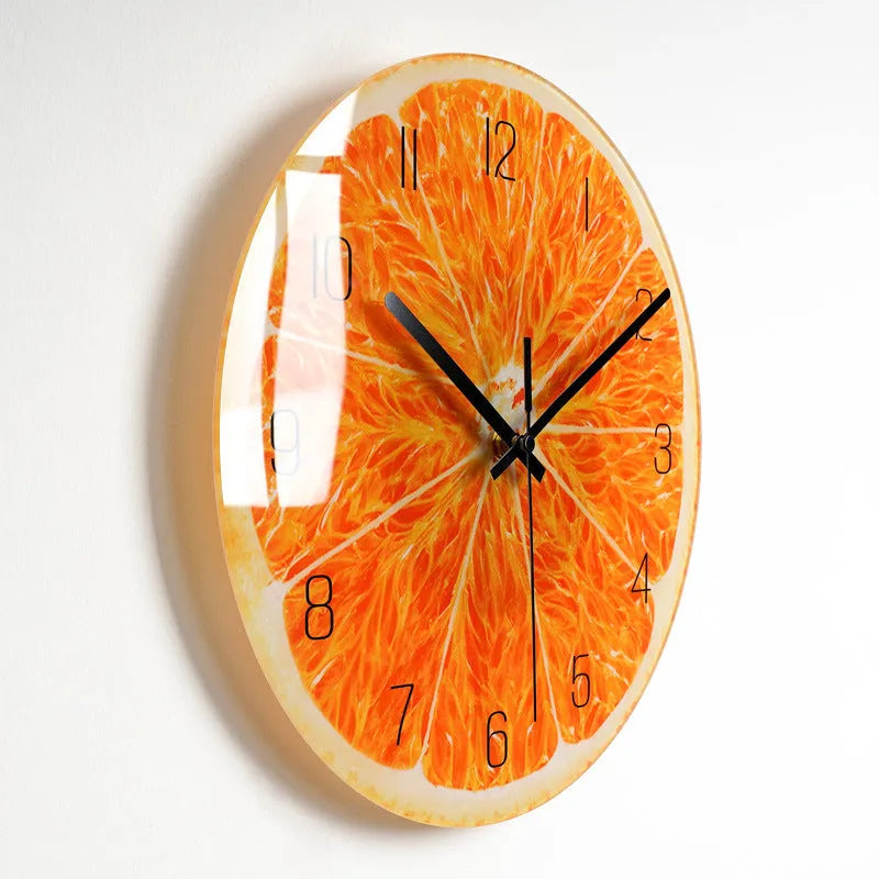 Round silent wall clock with acrylic glass dial, shown in a living room setting.