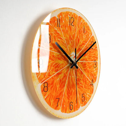 Round silent wall clock with acrylic glass dial, shown in a living room setting.