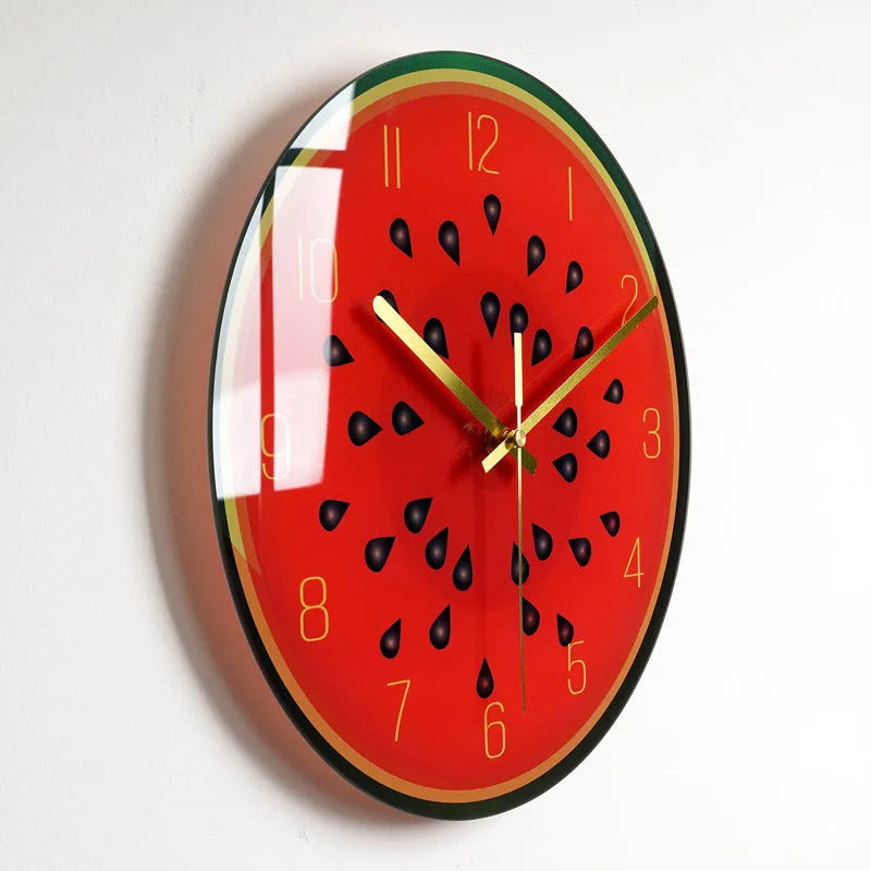 Round silent wall clock with acrylic glass dial, shown in a living room setting.