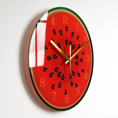 Round silent wall clock with acrylic glass dial, shown in a living room setting.
